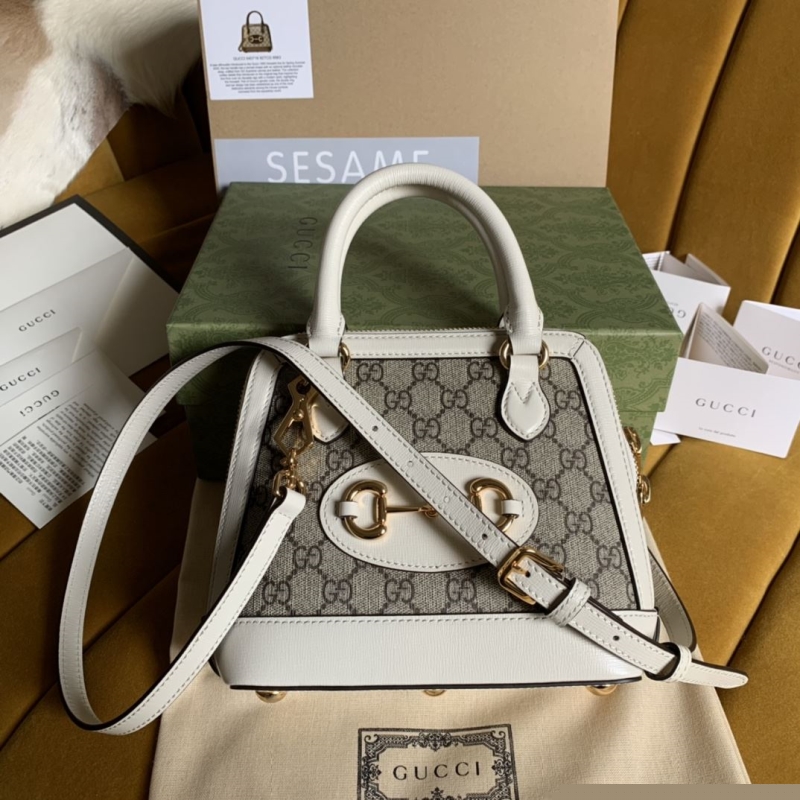 G*u*i top handle bags